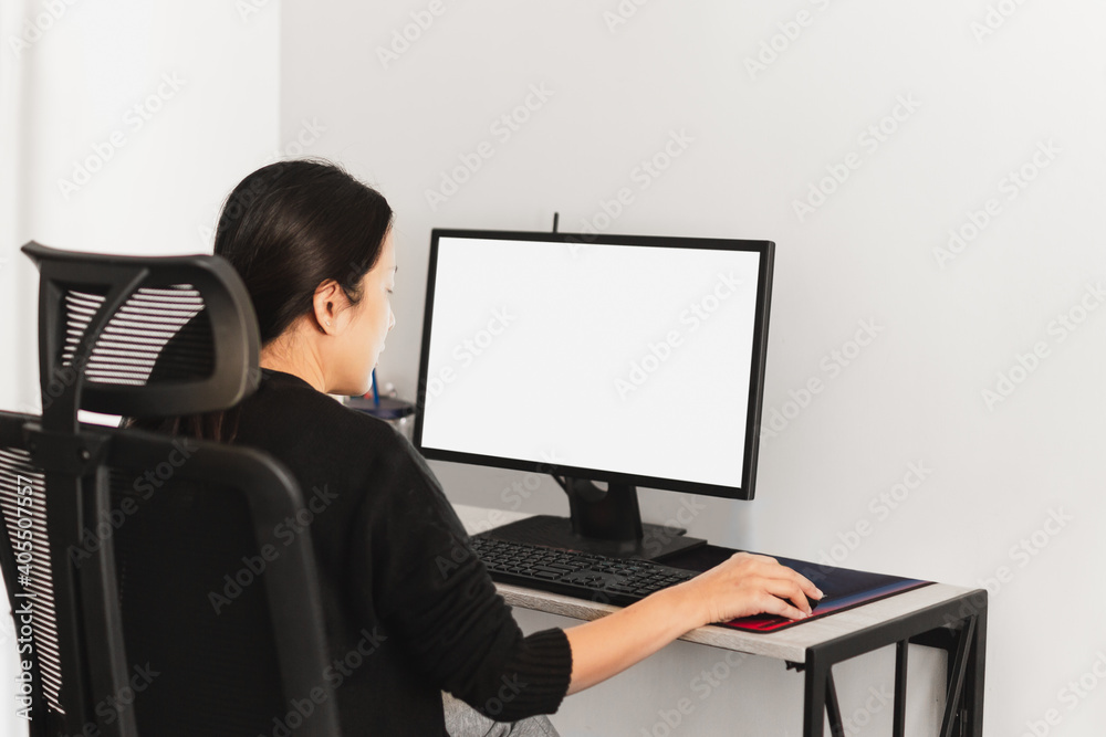 Woman working on computer at home during coromavirus pandemic. Woman working on computer at home during coromavirus pandemic.