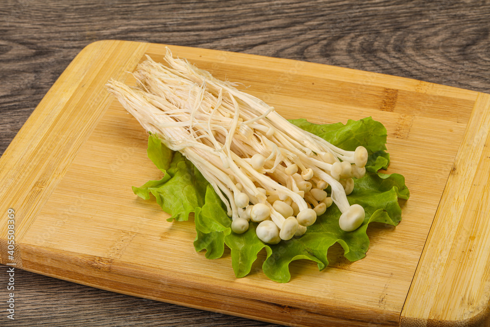 Raw Enoki mushrooms for cooking
