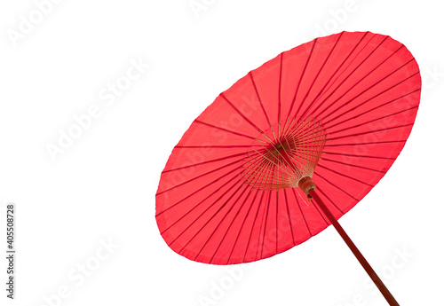 Red beach parasol against a blue sky backgrouRed beach parasol isolated on white backgroundnd