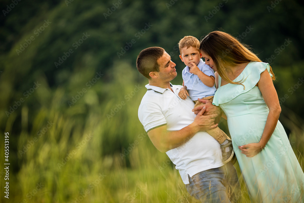 Young family having fun outdoors in the field Young family having fun outdoors in the field