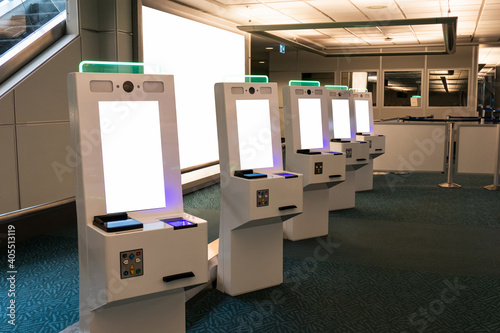Self service card dispenser with passport scanner touch screen in immigration zone at the airport