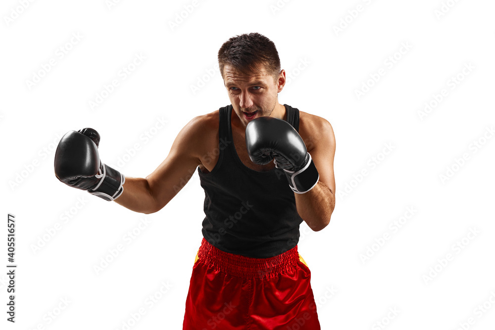 professional boxer man in black boxing gloves punching isolated on white background.