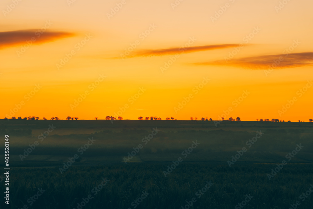 Beautiful morning landscape before sunrise in rural space, vibrant colors.