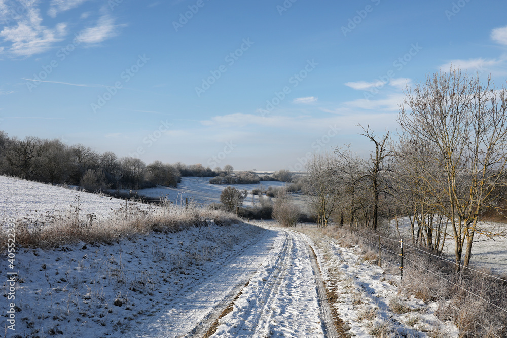 Winter landscape with snowy fields and blue sky Winter landscape with snowy fields and blue sky