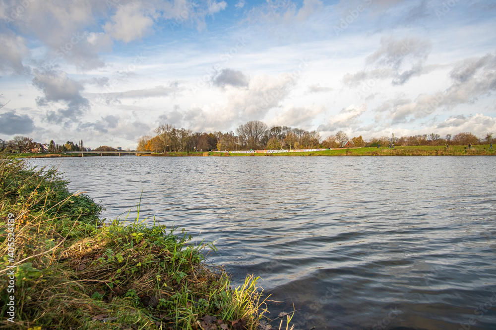 Obraz premium beautiful Werdersee, a river in bremen, in the sun with amazing sky