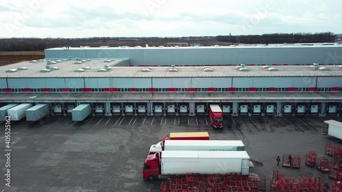 aerial view of mail delivery terminal, Aerial view of Cargo terminal of the postal service, Truck on the Industrial Warehouse, Distribution warehouse with trucks awaiting loading 