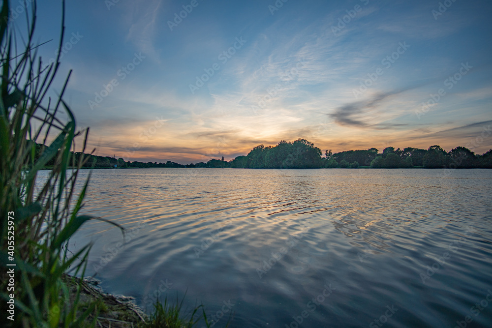 beautiful werdersee, a river in bremen, at sunset with amazing sky