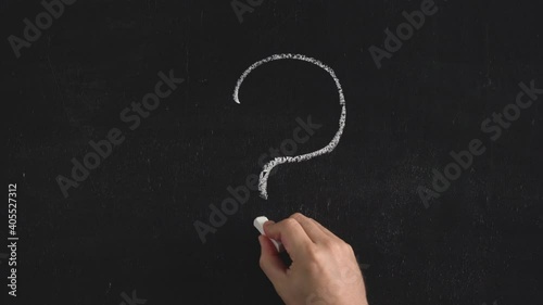 Hand man writes with chalk 