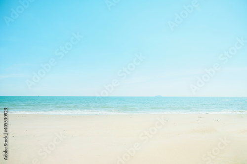 Landscape with white beach, the sea and the beautiful clouds in the blue sky