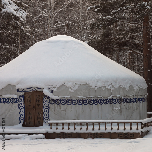 national nomadic house - yurt, in the winter in the forest