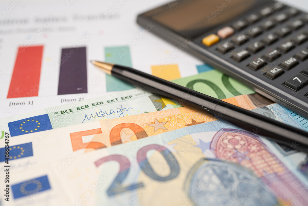 Euro banknotes money with calculator on chart graph paper. Financial development, Banking Account, Statistics, Investment Analytic research data economy, trading, Business company concept. Euro banknotes money with calculator on chart graph paper. Financial development, Banking Account, Statistics, Investment Analytic research data economy, trading, Business company concept.