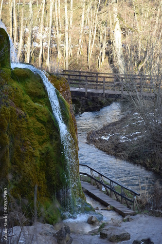 bunter Wasserfall Dreimühlen bei Nohn in der Eifel während des Winters photo