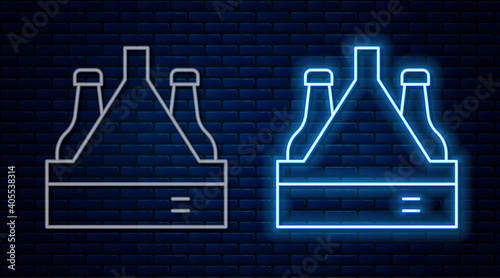 Glowing neon line Pack of beer bottles icon isolated on brick wall background. Case crate beer box sign. Vector.