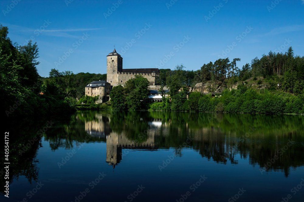 gothic castle on the lake at sunny weather
