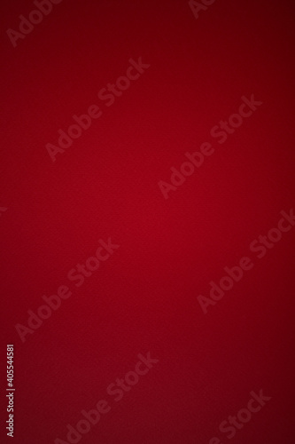 Red homogeneous vertical background with texture