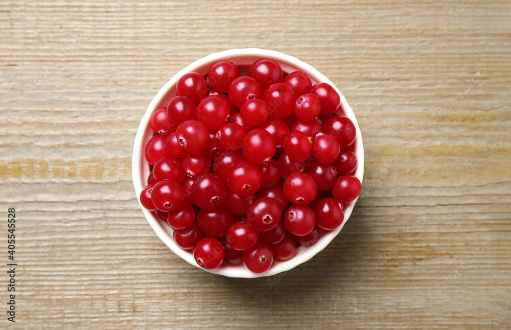 Tasty ripe cranberries on wooden table, top view Tasty ripe cranberries on wooden table, top view
