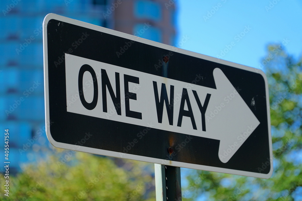 One way road sign with blurred background. One way road sign with blurred background.