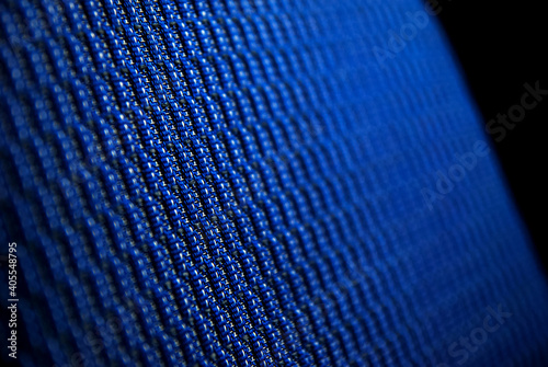 Closeup on blue upholstery in sport car. Structure of the material