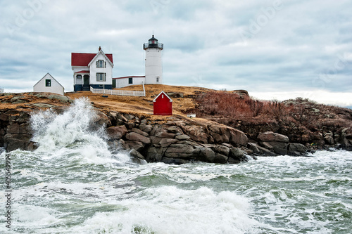 Nubble (Cape Neddick) Lighthouse Sits Above Rough Waves from an Outgoing Winter Storm in Maine
