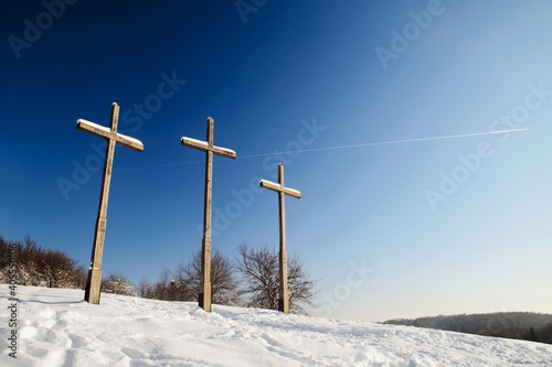 Three crosses in Kazimierz Dolny in winter. Sunny day, blue sky. Lubelskie Voivodeship