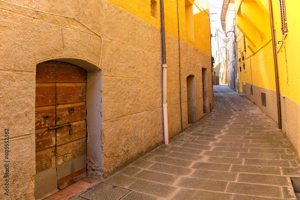 Fototapeta premium A quiet residential street in the historic medieval village of Batignano, Grosseto Province, Tuscany, Italy 