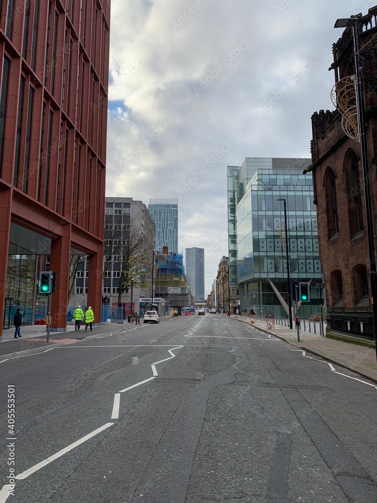 City street in Manchester City centre with buildings in the background. 
