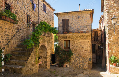 An historic stone residential building in the village of Montemerano near Manciano in Grosseto province, Tuscany, Italy 