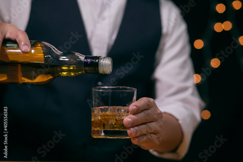 Bartender Serve Whiskey, on wood bar