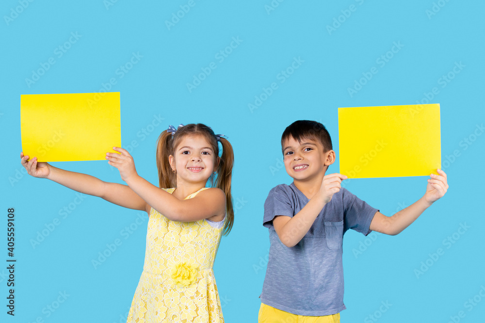 Preschool kids posing with yellow letterhead for your advertisement ...