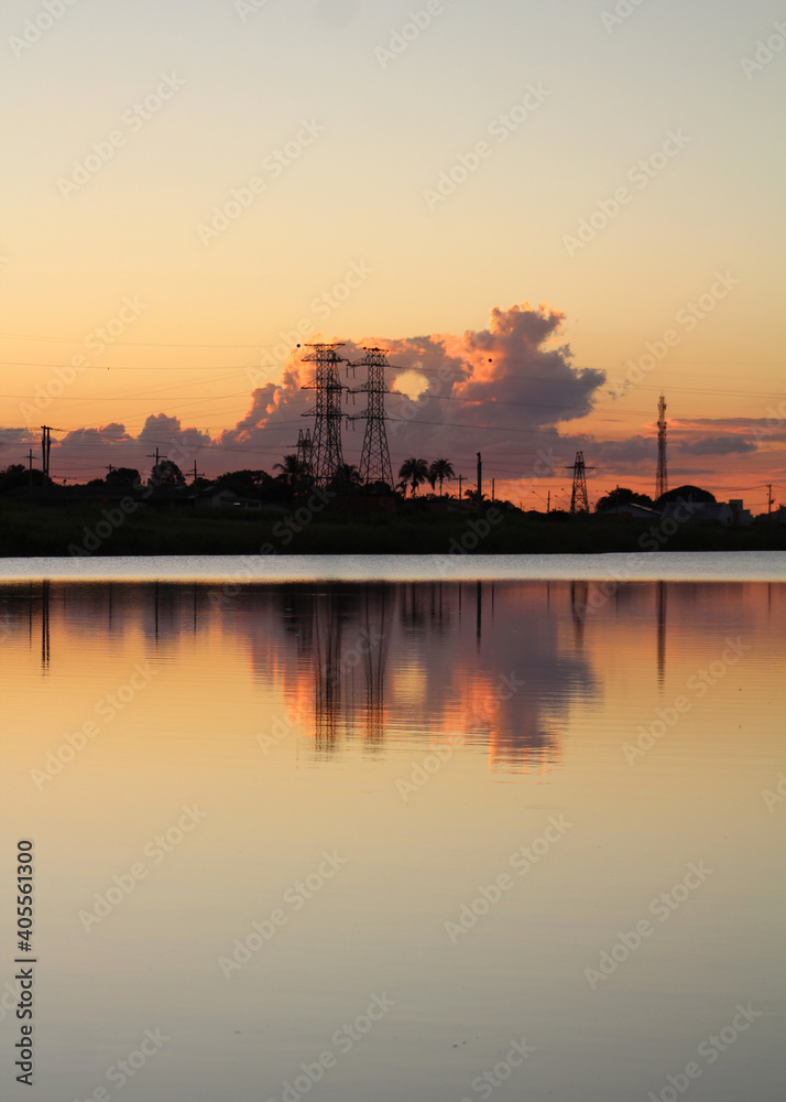 city ​​skyline and energy towers with reflection in the water