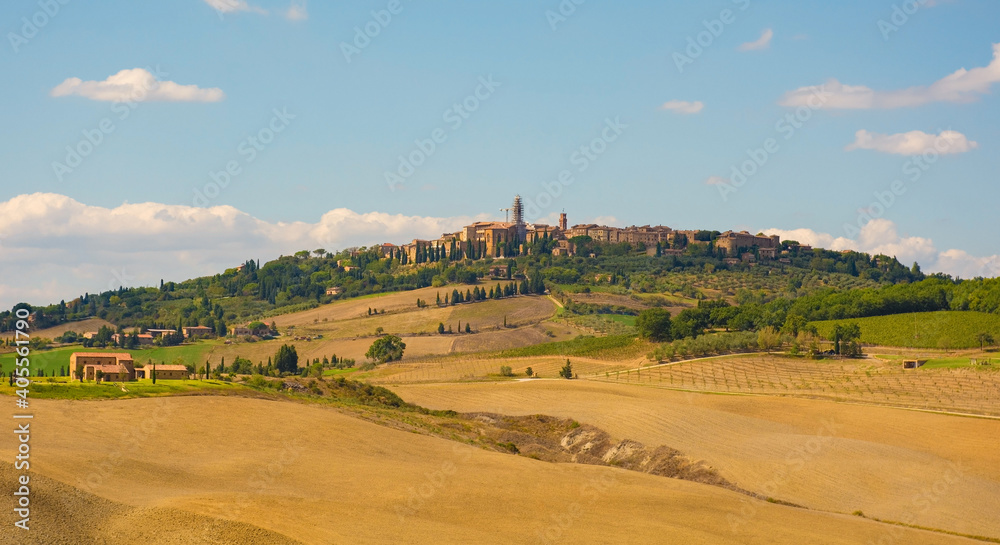 Fototapeta premium The late summer landscape around Monticchiello near Pienza in Val d'Orcia, Siena Province, Tuscany, Italy. Monticchiello village can be seen on the hill in the background 