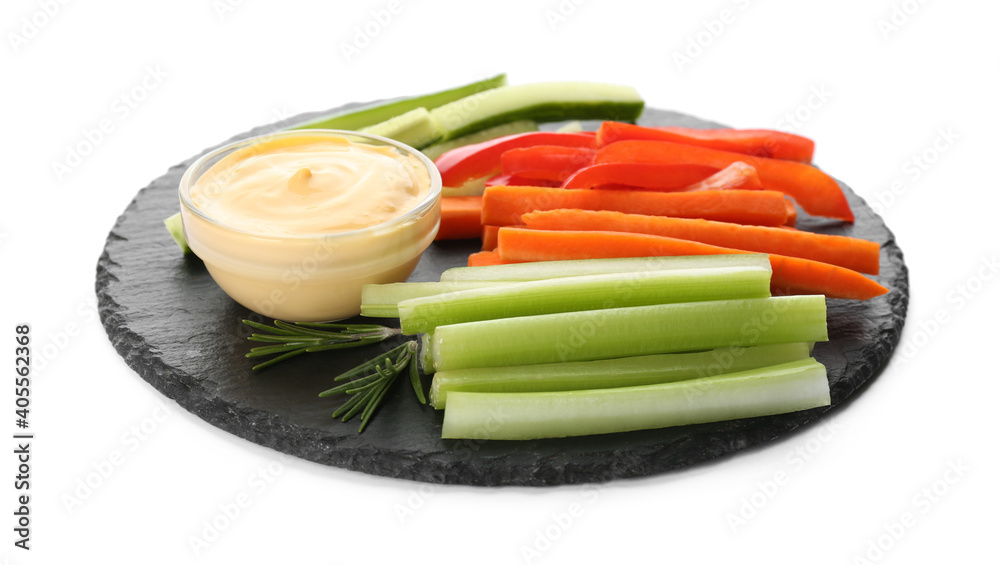 Slate plate with dip sauce, celery and other vegetable sticks isolated on white