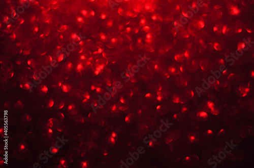 Red sparkling defocused light on black background, Red bokeh, abstract background stock photo, Valentine's Day - Holiday; Christmas