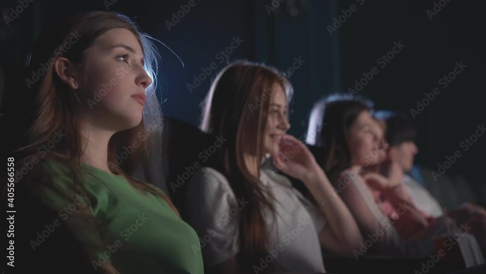 Group of friends watching comedy in cinema. Group of friends watching comedy in cinema.