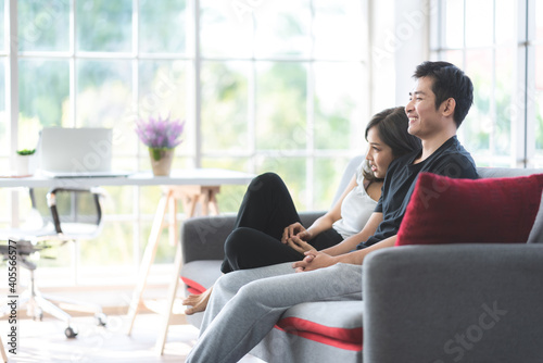 new normal of 2 people young couple stay home, relaxing and happy lifestyle together, social distancing lockdown and self-isolation quarantine