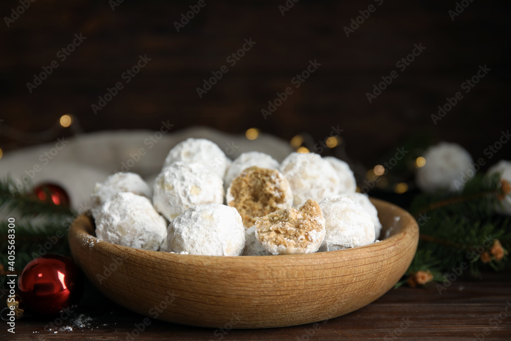 Tasty snowball cookies in wooden bowl. Christmas treat Tasty snowball cookies in wooden bowl. Christmas treat