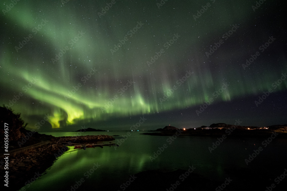 Green aurora reflections over water in norway