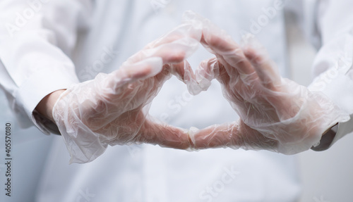 heart sign shown with gloved hands