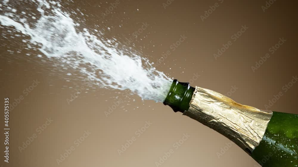 Super slow motion of Champagne explosion, opening champagne bottle closeup. Filmed on high speed cinema camera, 1000fps