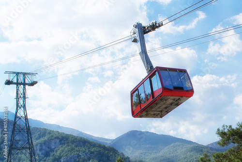 Alpine landscape with an elevated cable car.