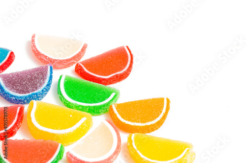 A Variety of Multicolored Candy Fruit Slice on a White Background