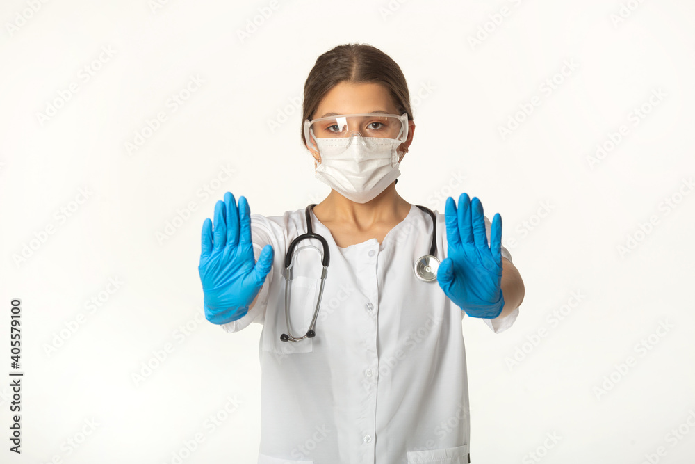 young woman in medical uniform on white background with hand gesture young woman in medical uniform on white background with hand gesture