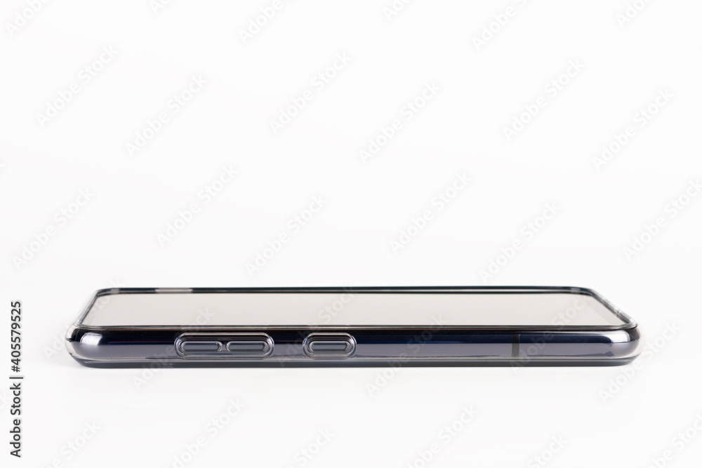 Close up of side buttons of touchscreen smartphone in silicone cover. Volume control buttons a google assistant key. Close up of side buttons of touchscreen smartphone in silicone cover. Volume control buttons a google assistant key.
