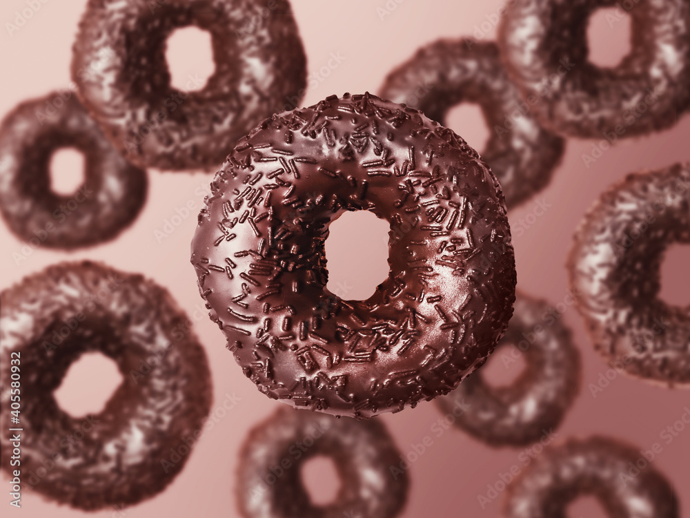 donuts with chocolate glaze and chocolate sprinkles falling on brown background donuts with chocolate glaze and chocolate sprinkles falling on brown background