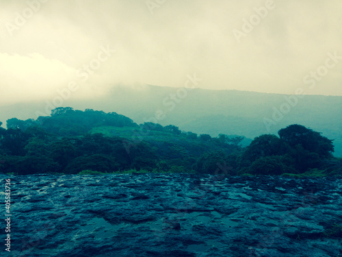 Landscape on top of a hill with monsoon puddles