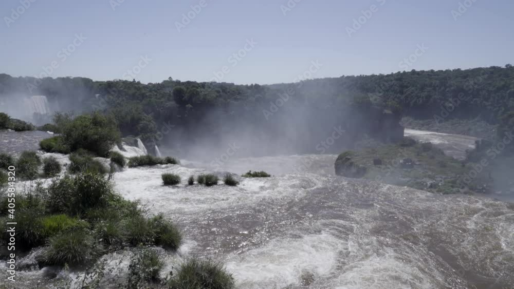 Iguazu Fa Iguazu Falls are waterfalls of the Iguazu River on the border between Argentina and Brazil. They are the largest waterfall system in the world. Iguazu Fa Iguazu Falls are waterfalls of the Iguazu River on the border between Argentina and Brazil. They are the largest waterfall system in the world.