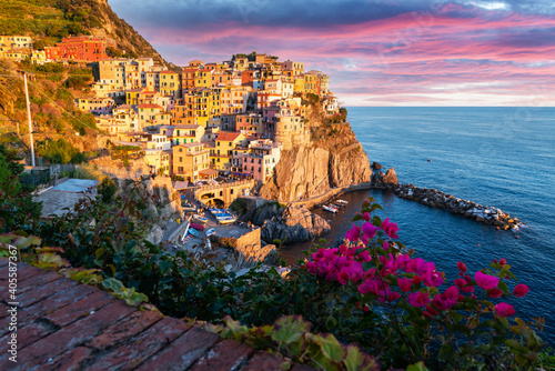 Fototapeta Naklejka Na Ścianę i Meble -  Fantastic landscape of Manarola city with costal rocks on a foreground. Cinque Terre National Park, Liguria, Italy, Europe