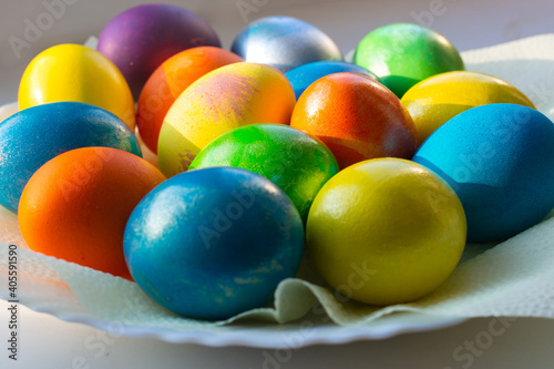 Chicken eggs are painted in bright colors. Feast of Holy Easter