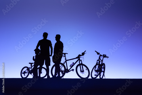 sport background with silhoettes of biker and mountain bikes