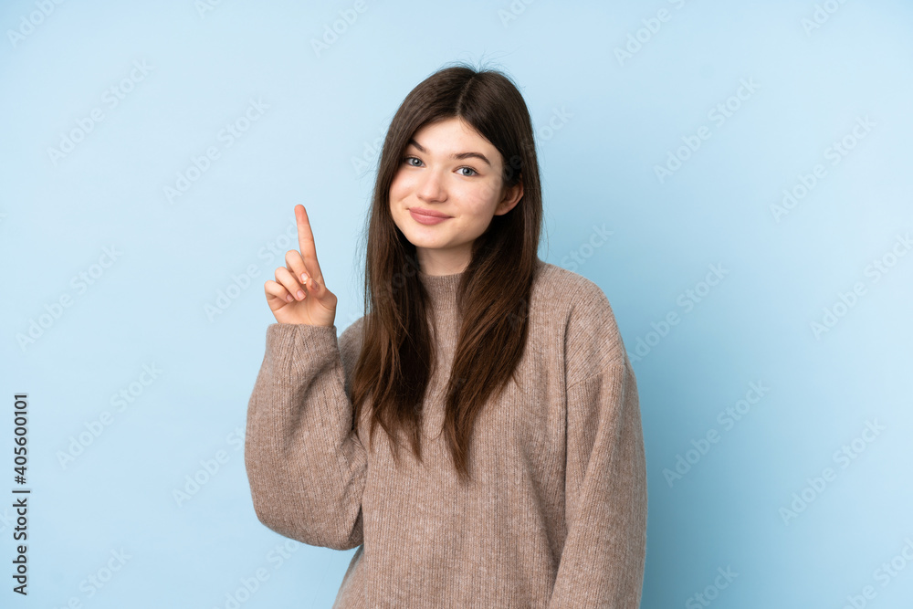 Young Ukrainian teenager girl wearing a sweater over isolated blue background pointing with the index finger a great idea Young Ukrainian teenager girl wearing a sweater over isolated blue background pointing with the index finger a great idea